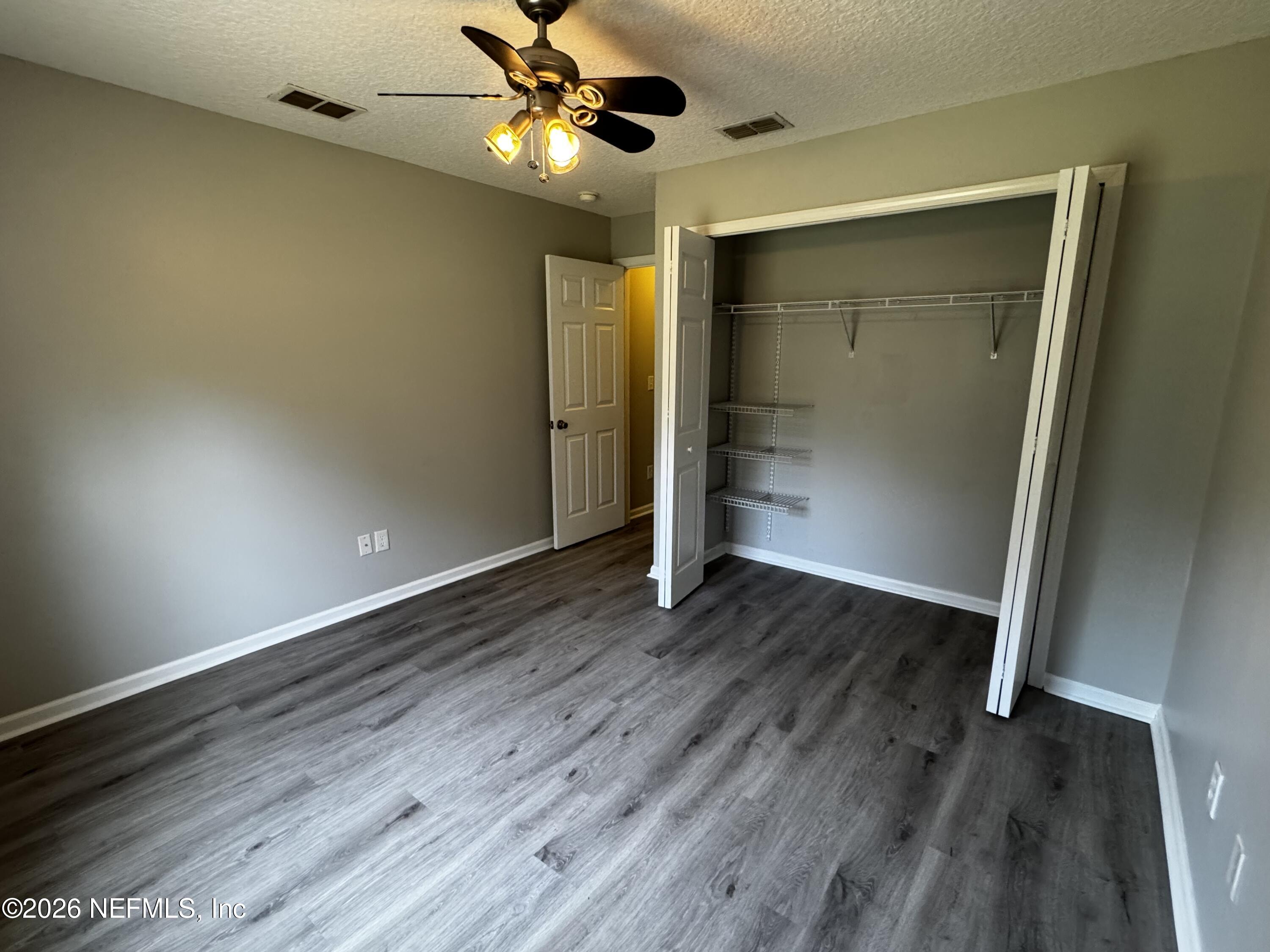 16255 Shellcracker Road Jacksonville, FL 32226 - Photo 29 of 40 a view of an empty room and wooden floor