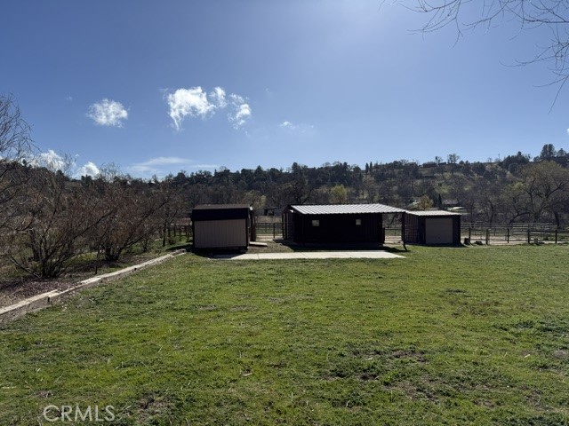26931 Columbia Way Tehachapi, CA 93561 - Photo 19 of 49 Shed for hay, tack room and garden shed plus covered patio or grooming area.
