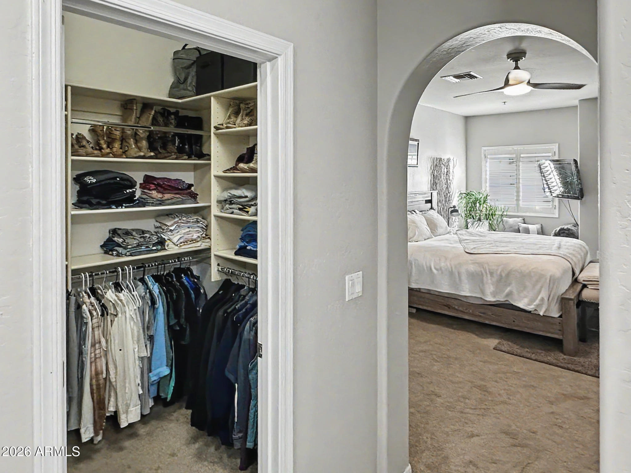 3935 East Rough Rider Road, Unit 1144 Phoenix, AZ 85050 - Photo 11 of 31 a bedroom with a bed and closet