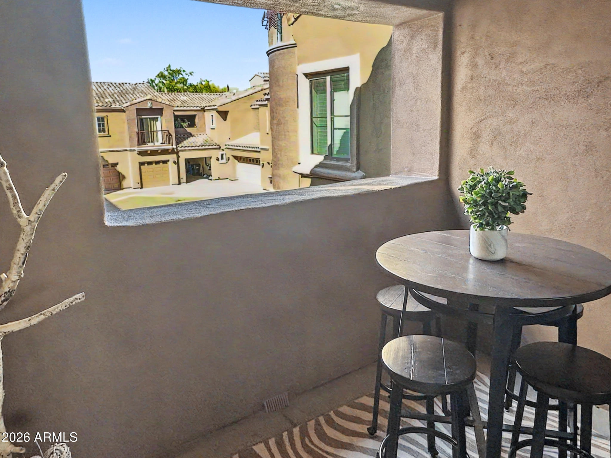 3935 East Rough Rider Road, Unit 1144 Phoenix, AZ 85050 - Photo 14 of 31 a dining room with furniture and window