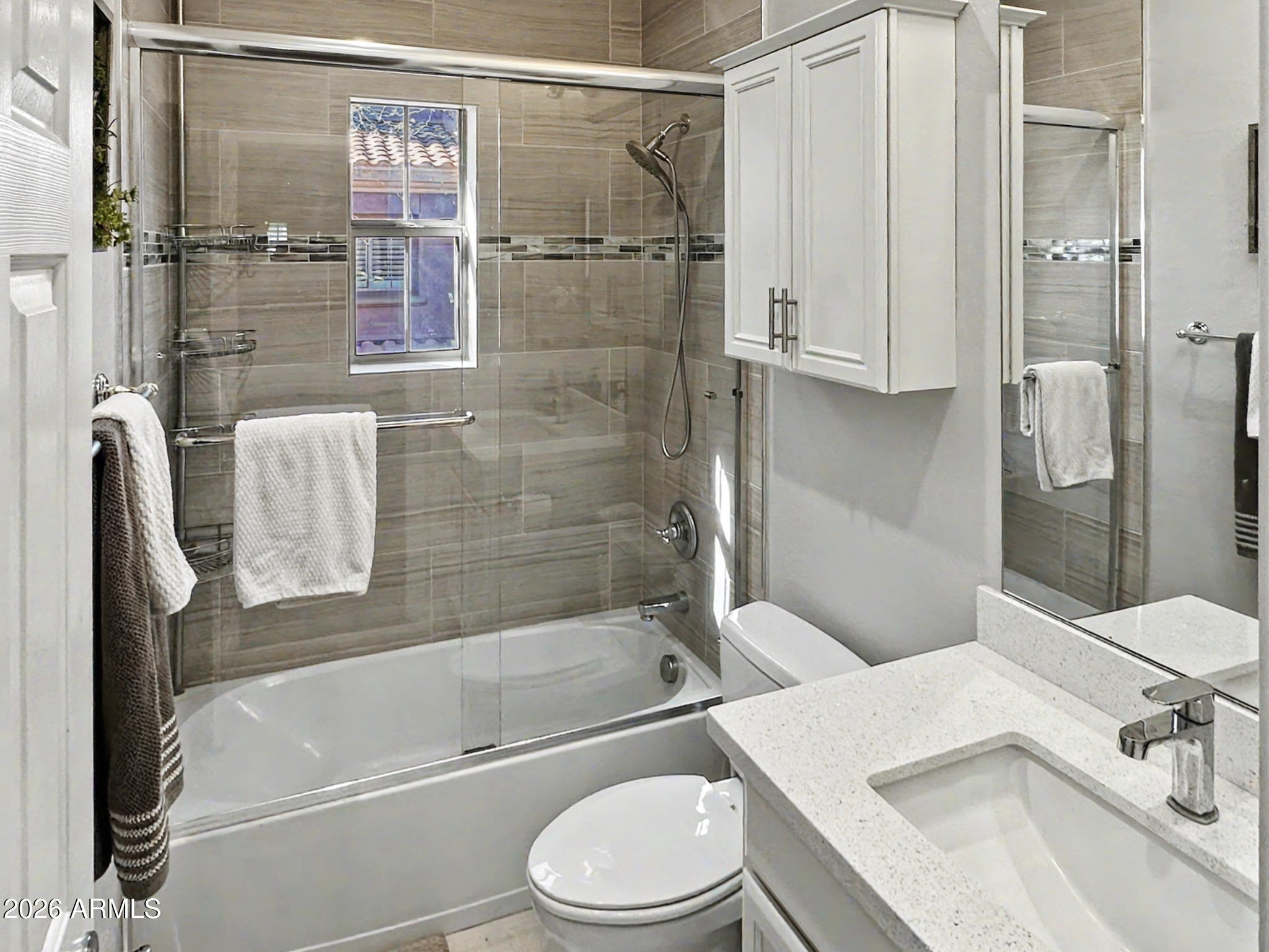 3935 East Rough Rider Road, Unit 1144 Phoenix, AZ 85050 - Photo 16 of 31 a bathroom with a toilet sink and shower