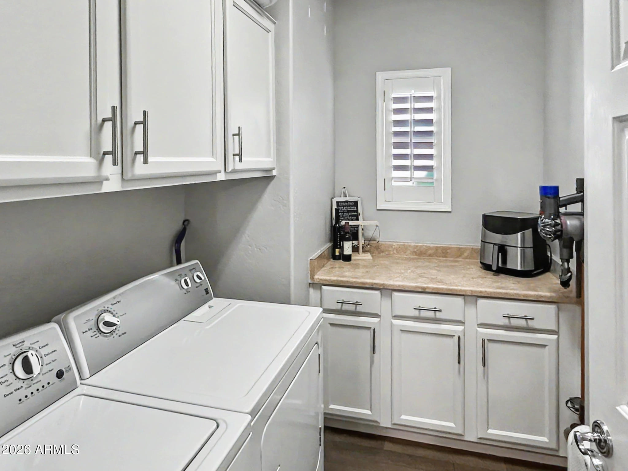 3935 East Rough Rider Road, Unit 1144 Phoenix, AZ 85050 - Photo 17 of 31 a utility room with sink dryer and washer