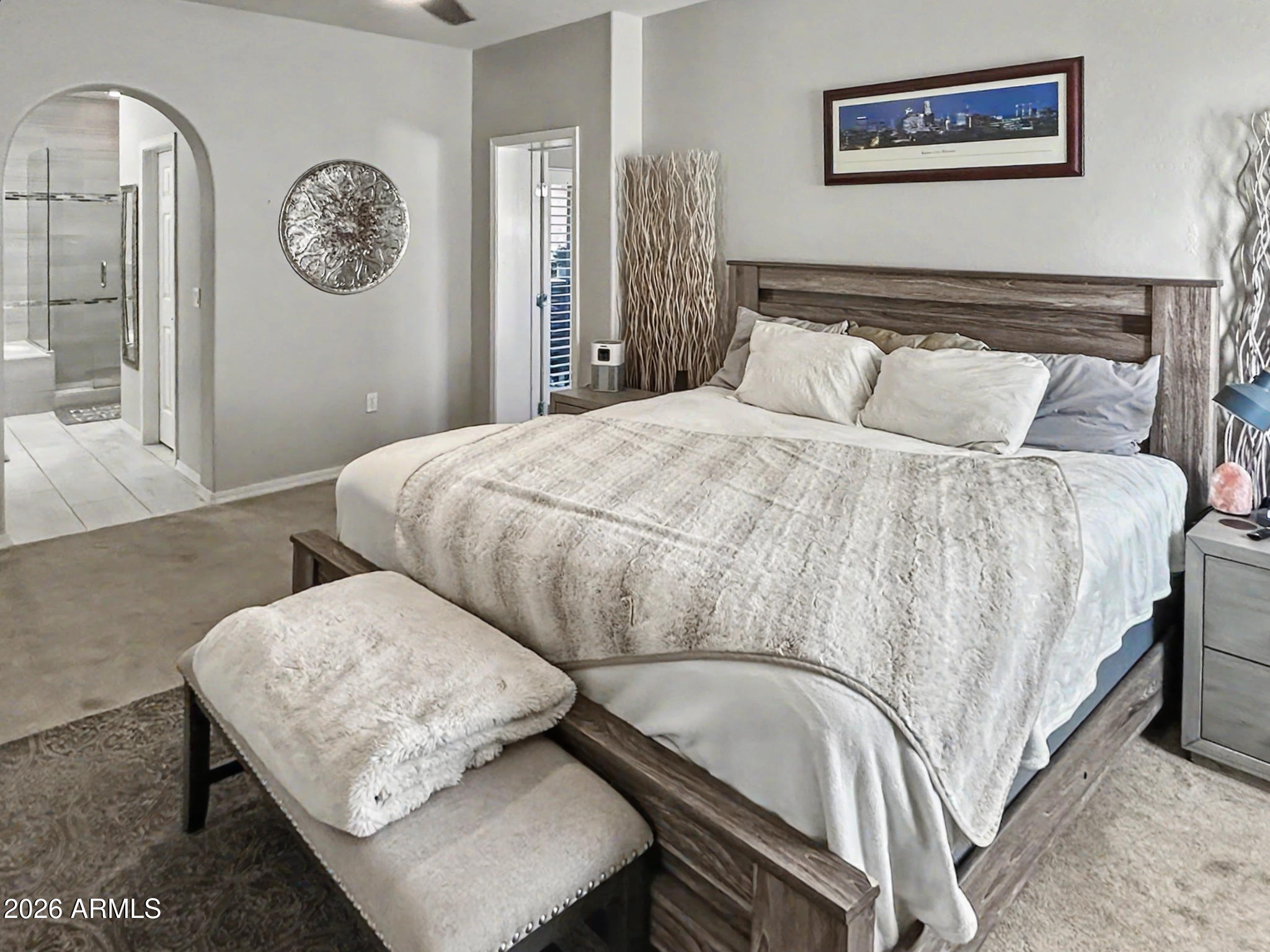 3935 East Rough Rider Road, Unit 1144 Phoenix, AZ 85050 - Photo 7 of 31 a bedroom with a bed and a table in it