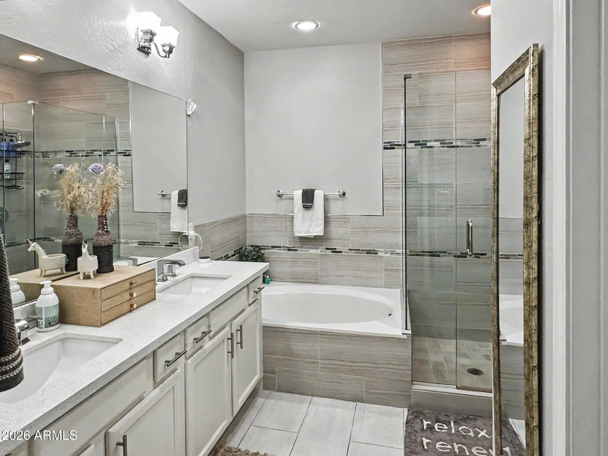 3935 East Rough Rider Road, Unit 1144 Phoenix, AZ 85050 - Photo 9 of 31 a bathroom with a granite countertop sink a toilet and shower
