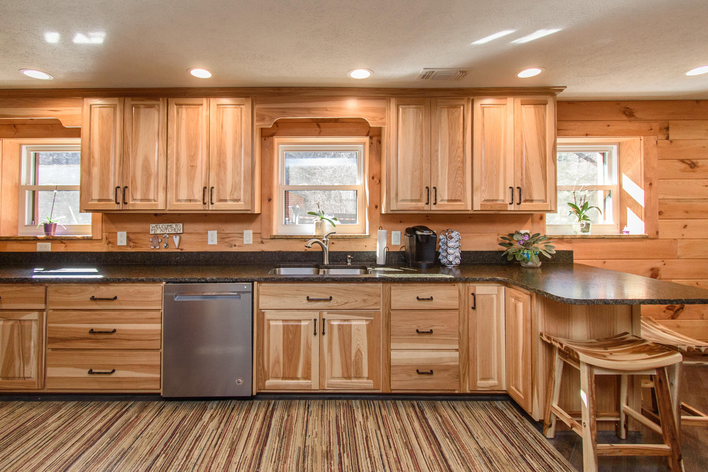 1804 Garlick Road Elliston, VA 24087 - Photo 12 of 95 a kitchen with stainless steel appliances granite countertop wooden cabinets a sink and a stove