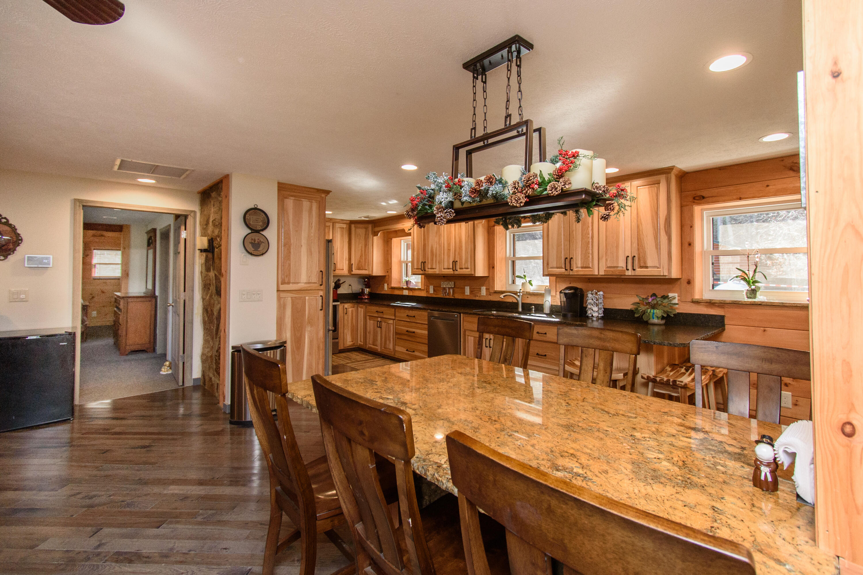1804 Garlick Road Elliston, VA 24087 - Photo 15 of 95 a dining room filled chandelier and wooden floor