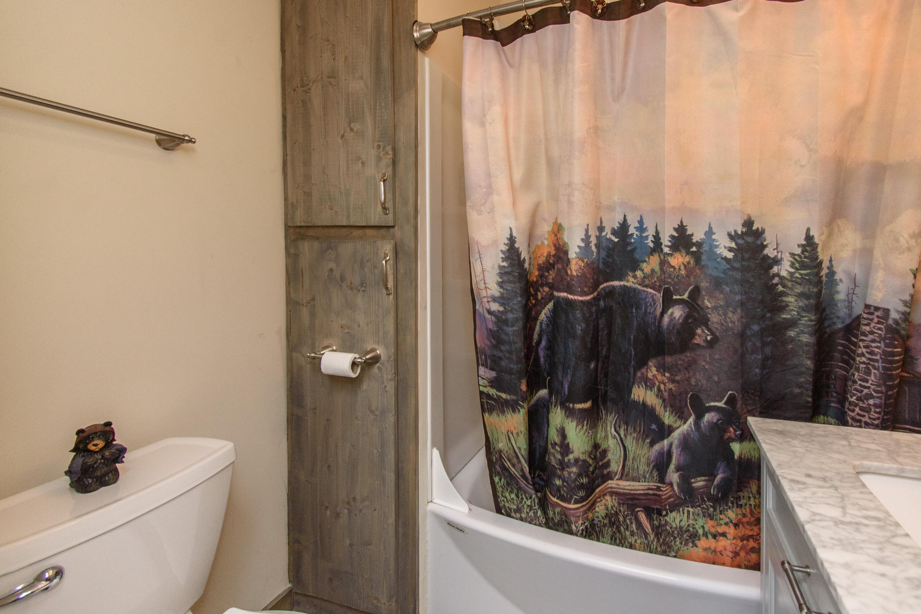 1804 Garlick Road Elliston, VA 24087 - Photo 38 of 95 a bathroom with a granite countertop sink a toilet and shower curtain