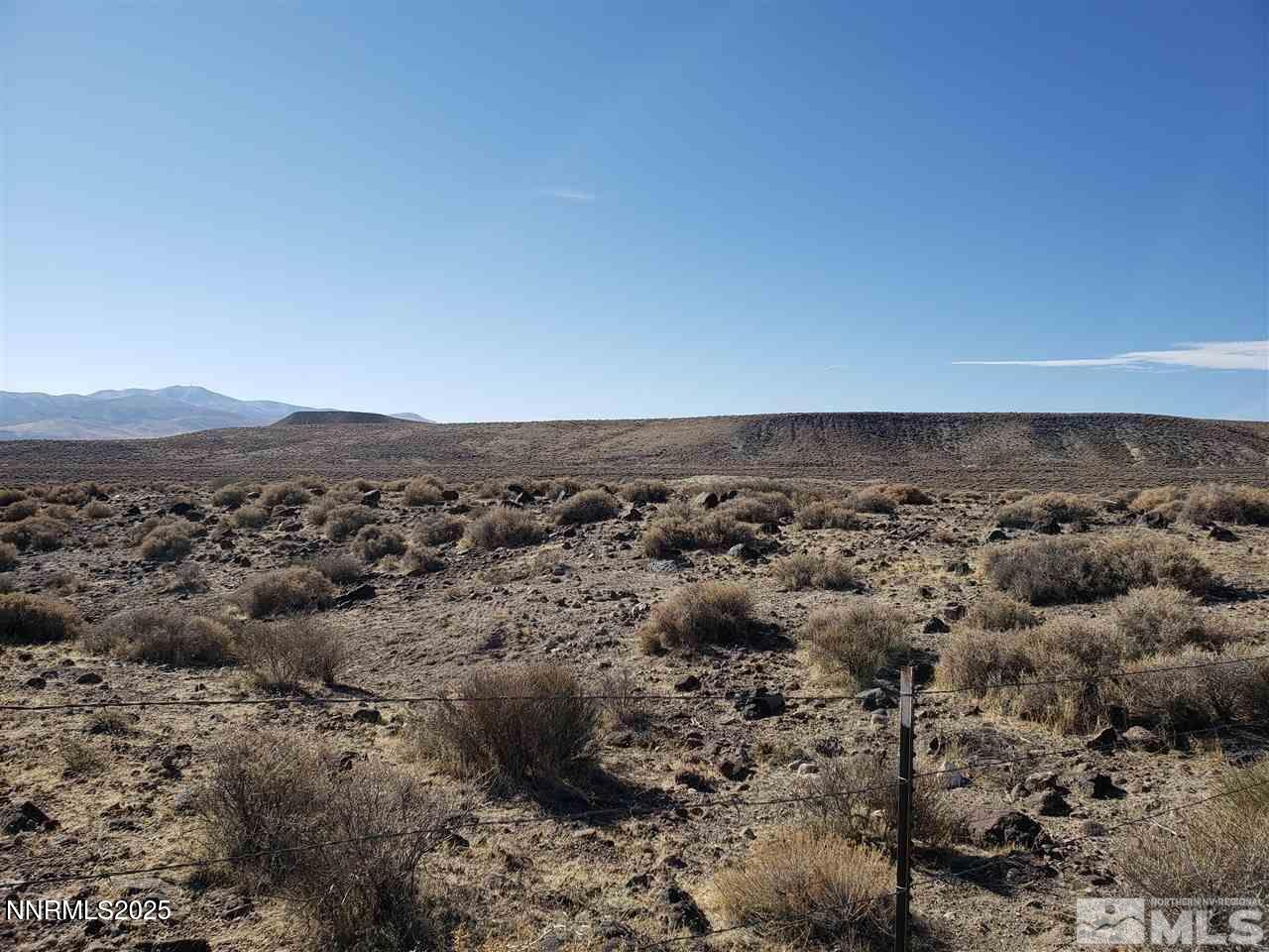 an aerial view of houses covered in trees