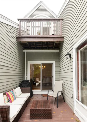 a view of deck patio with table and chairs and wooden floor
