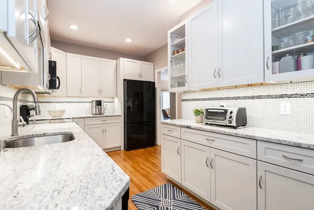 a bathroom with a sink toilet and mirror