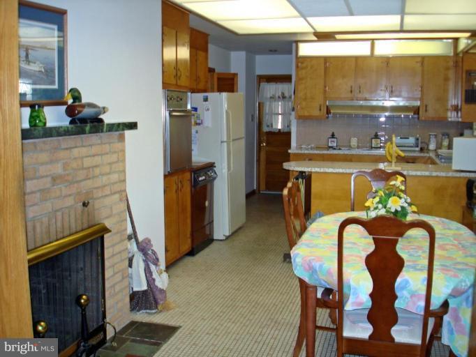 216 West Ring Factory Road Bel Air, MD 21014 - Photo 5 of 11 Kitchen/Breakfast room with a fireplace.