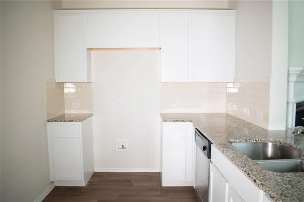 a kitchen with a sink and a refrigerator