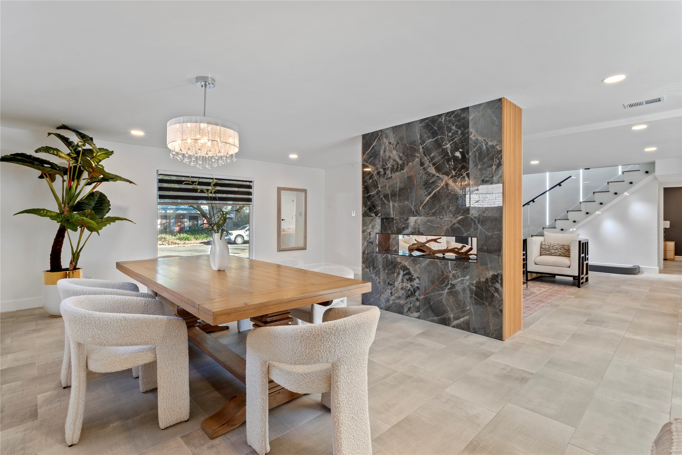 6604 Lexington Road Austin, TX 78757 - Photo 13 of 33 Dining room featuring an accent wall, recessed lighting, stairway, and a chandelier