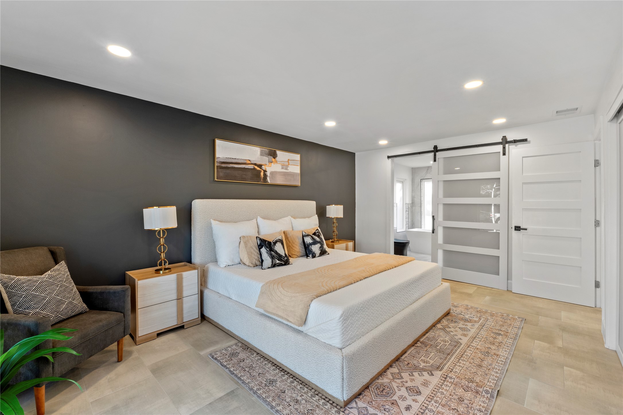 6604 Lexington Road Austin, TX 78757 - Photo 15 of 33 Primary bedroom includes walk in bathroom suite.