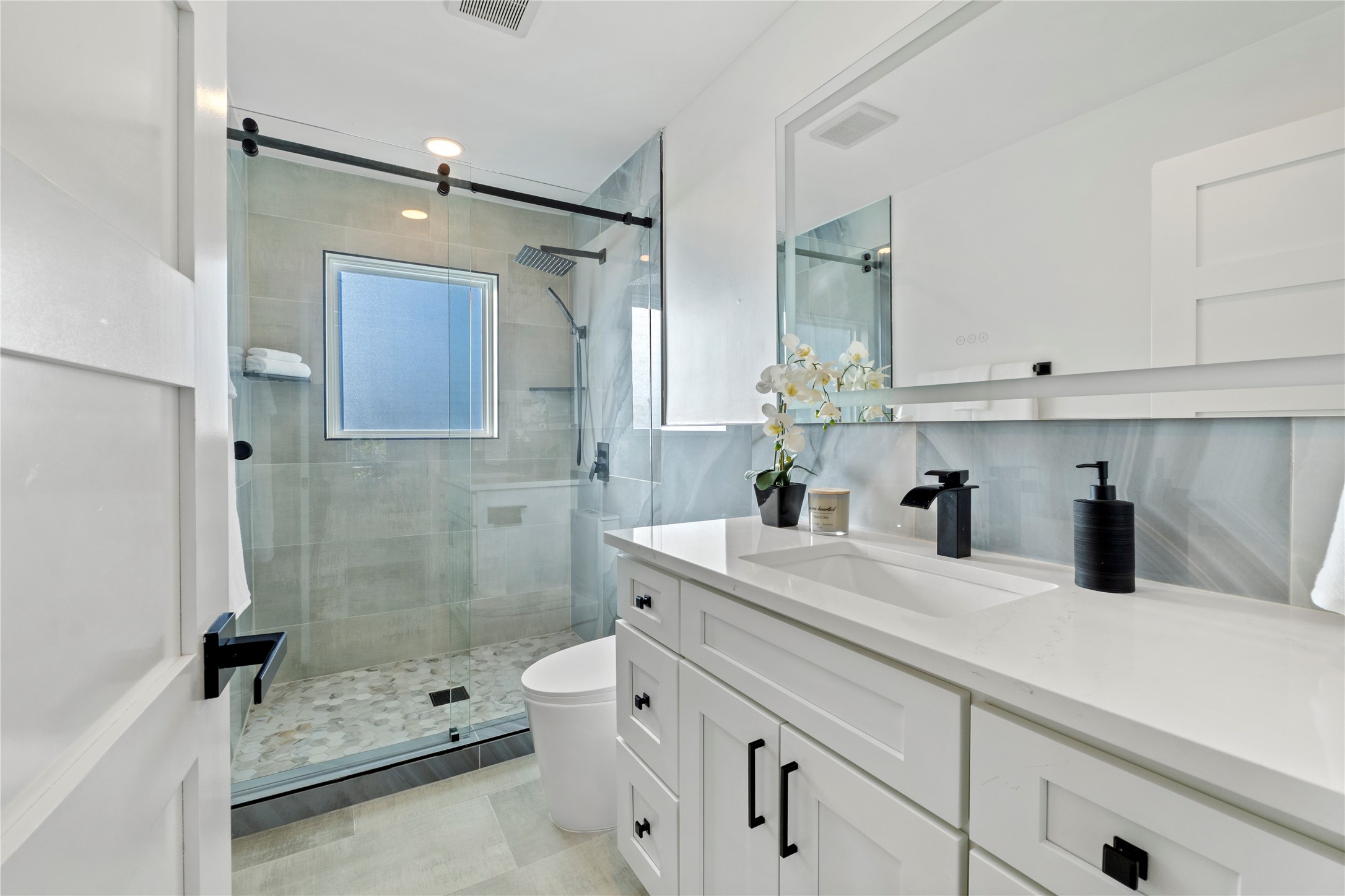6604 Lexington Road Austin, TX 78757 - Photo 23 of 33 Upstairs 3rd bathroom with walk in shower.