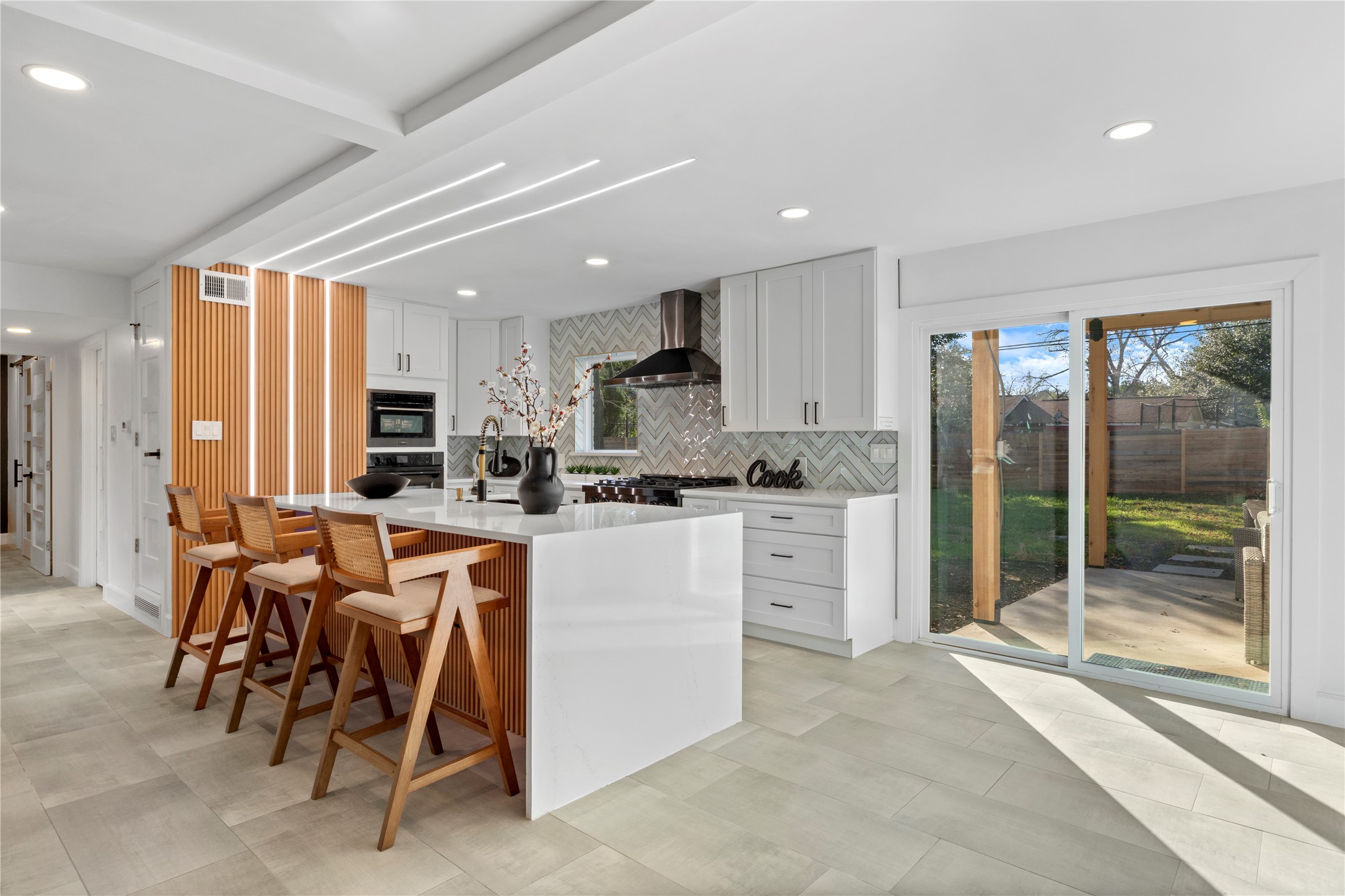 6604 Lexington Road Austin, TX 78757 - Photo 7 of 33 Z Line Built In Appliances with access to covered backyard porch view.