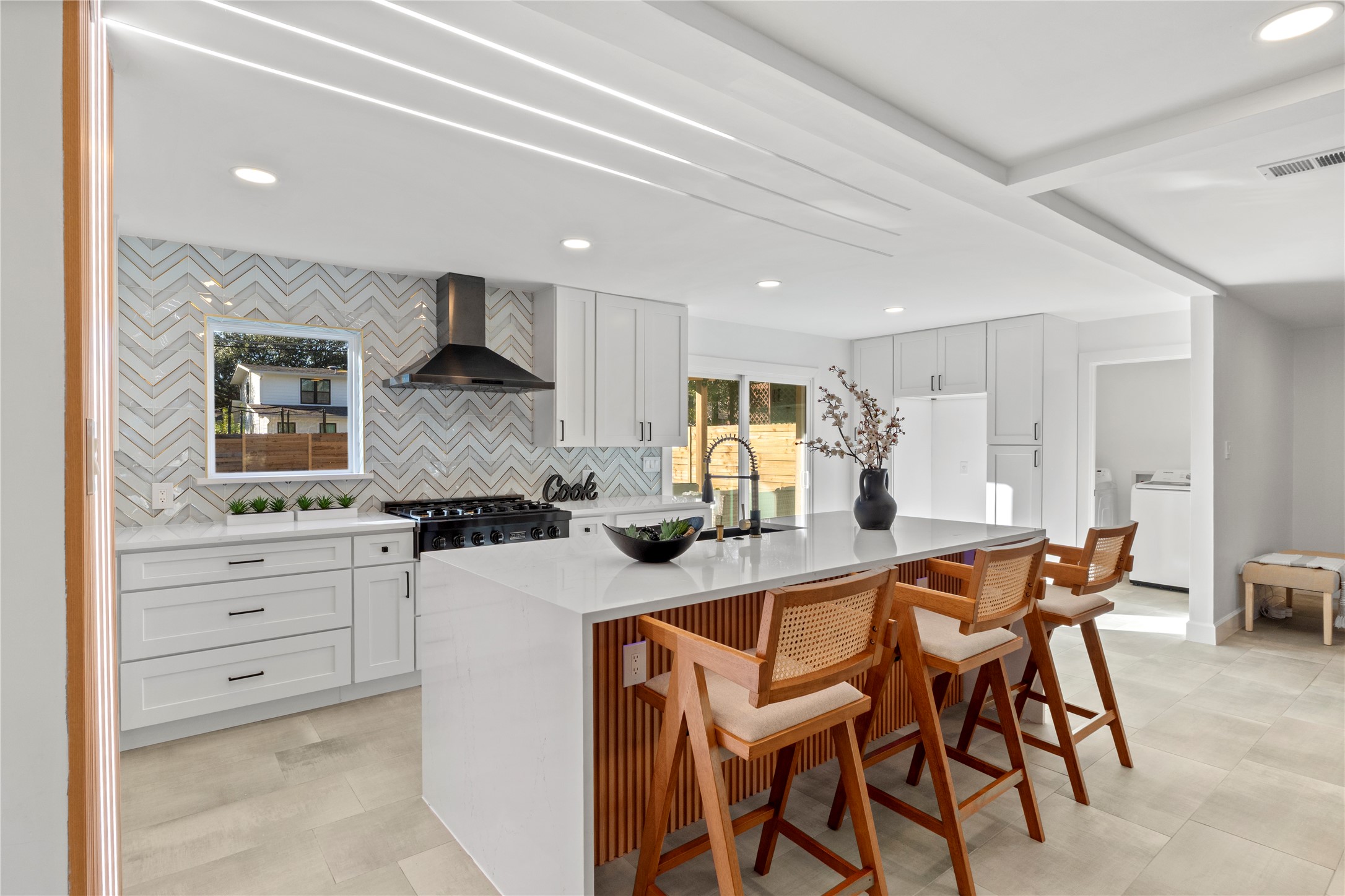 6604 Lexington Road Austin, TX 78757 - Photo 33 of 33 Quartz counters and beautiful light in this open floorplan home.
