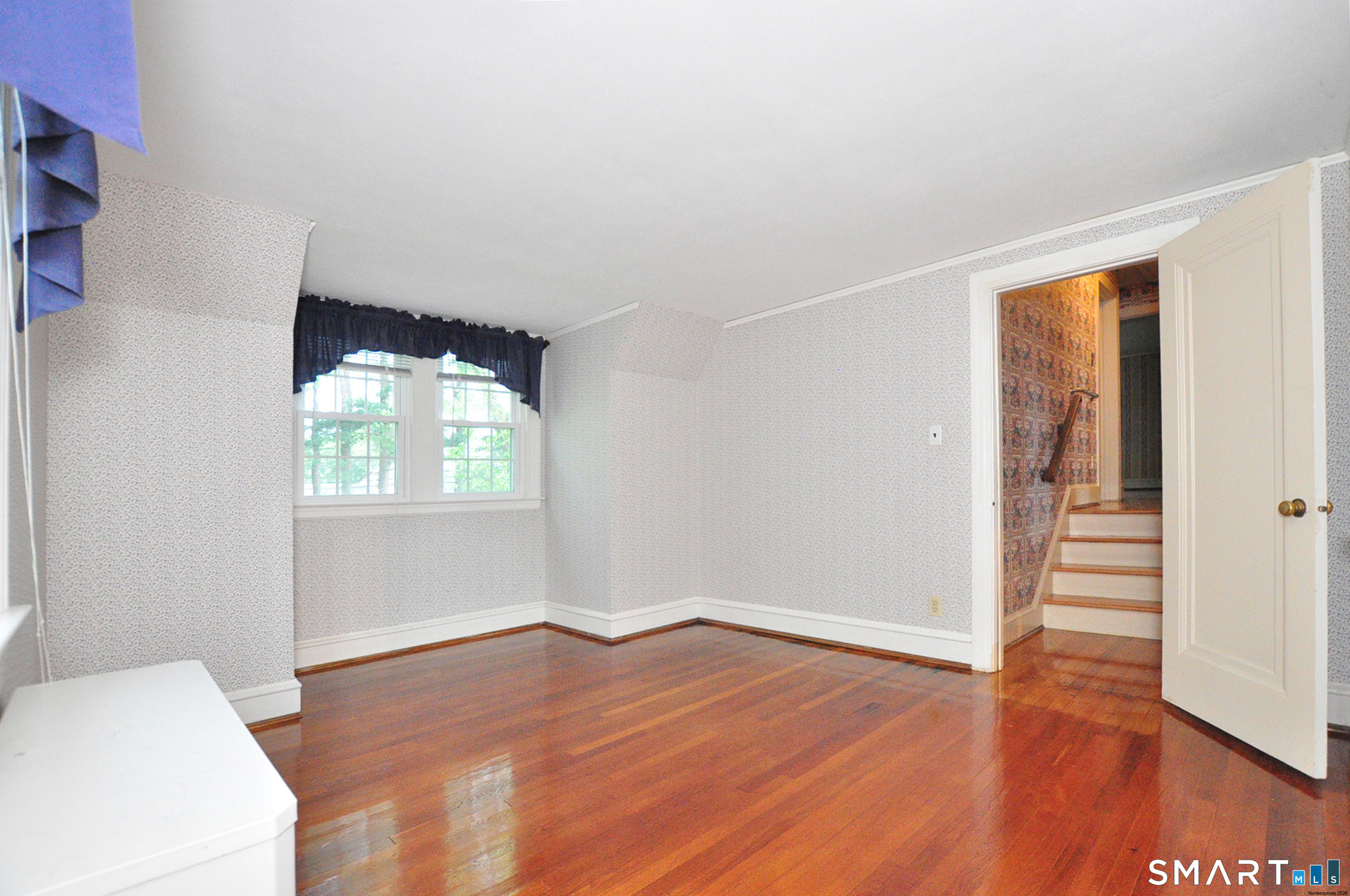 10 Harvey Road Windsor, CT 06095 - Photo 19 of 36 an empty room with wooden floor and windows
