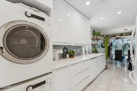 a view of a kitchen with washer and dryer