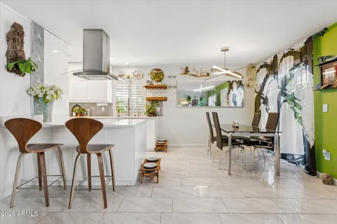 a workspace with furniture and a potted plant