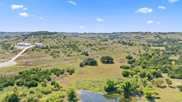 a view of a lake with a yard