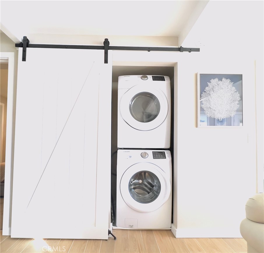 35091 Beach Road Dana Point, CA 92624 - Photo 12 of 27 a view of a hallway with washer and dryer