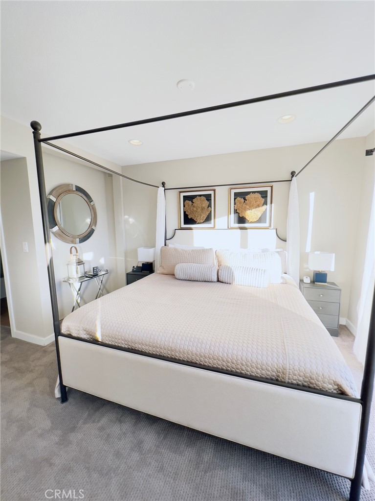 35091 Beach Road Dana Point, CA 92624 - Photo 15 of 27 a bedroom with a bed and a mirror