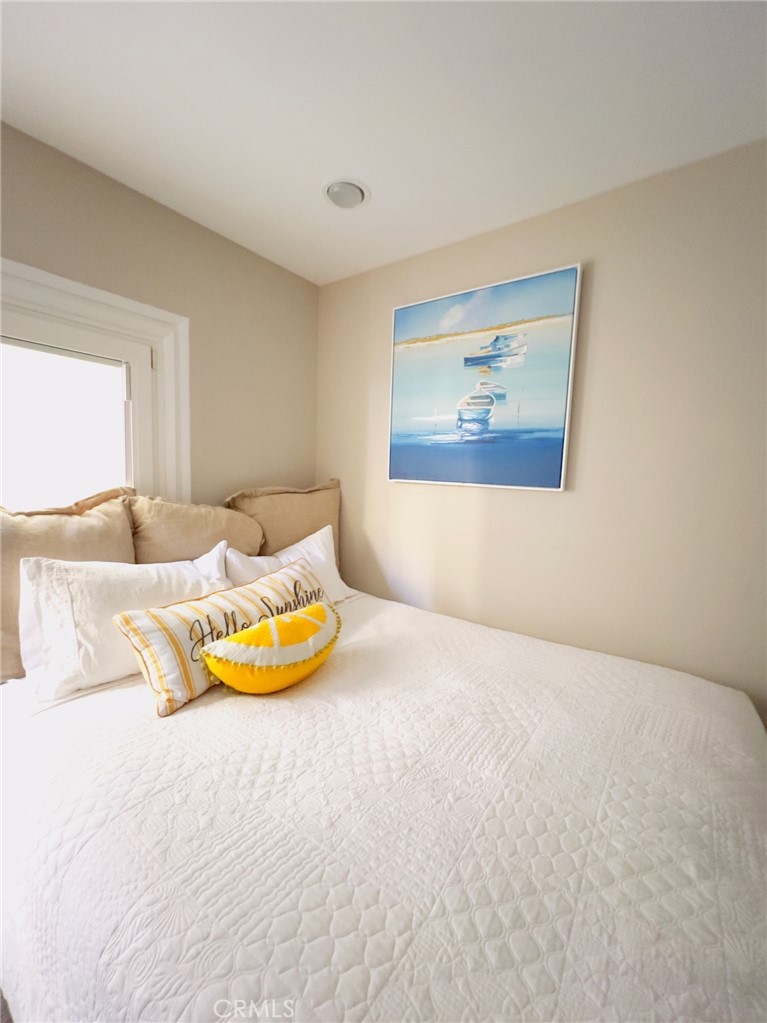 35091 Beach Road Dana Point, CA 92624 - Photo 18 of 27 a bedroom with a bed and painting on the wall