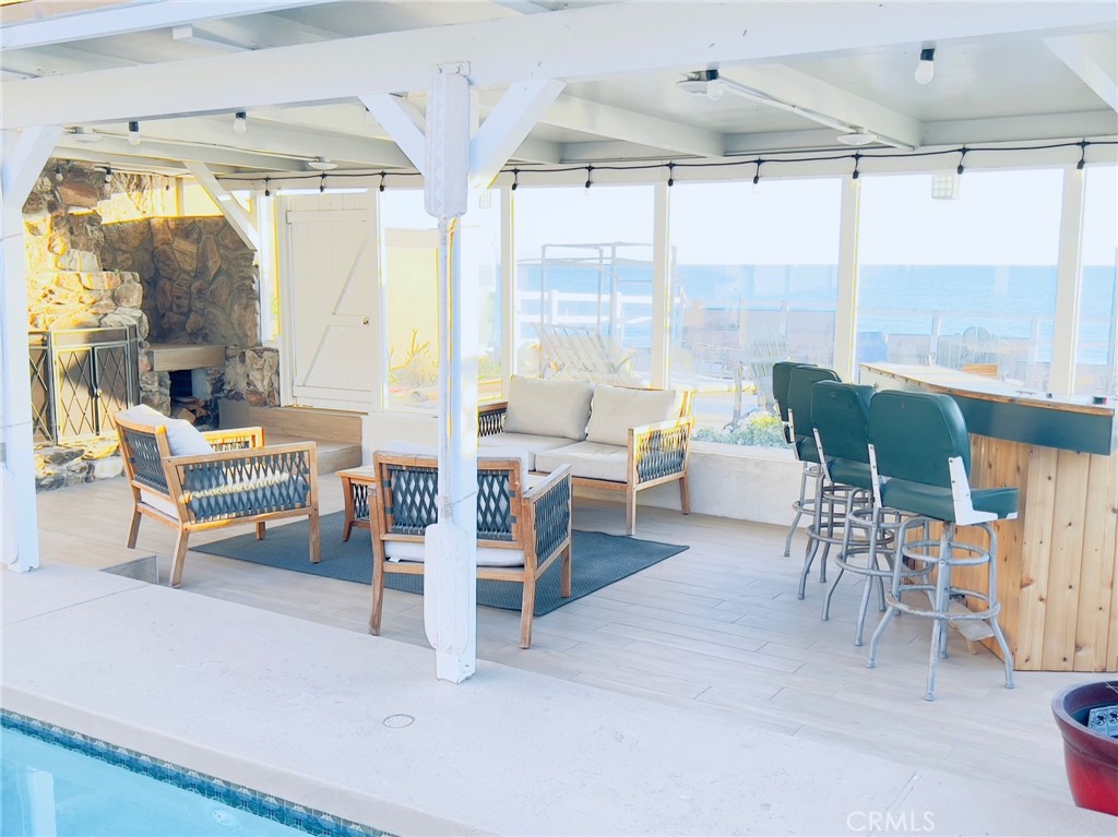 35091 Beach Road Dana Point, CA 92624 - Photo 20 of 27 a living room with furniture a table and a large window