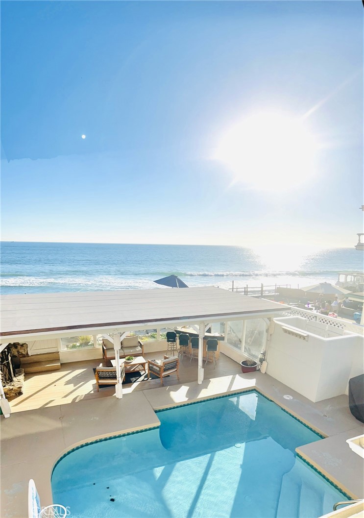 35091 Beach Road Dana Point, CA 92624 - Photo 2 of 27 a view of a living room filled with furniture and kitchen view