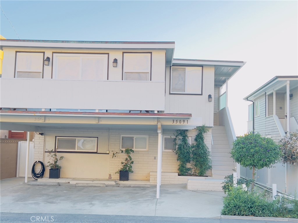35091 Beach Road Dana Point, CA 92624 - Photo 4 of 27 a view of a house with a outdoor space