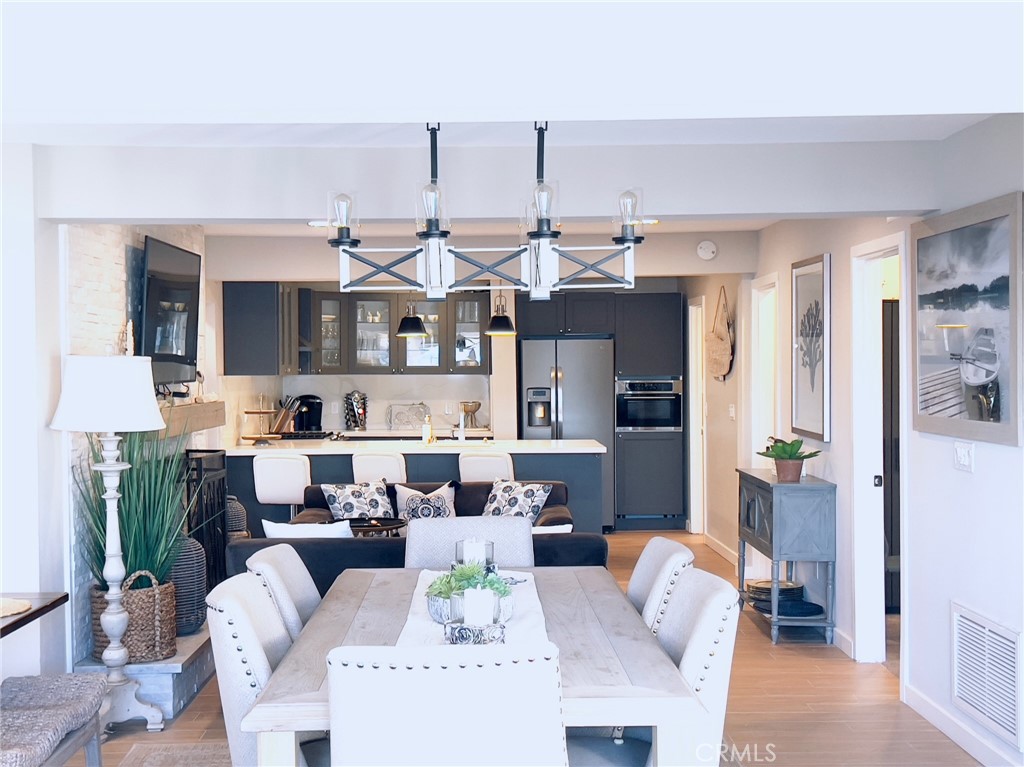 35091 Beach Road Dana Point, CA 92624 - Photo 6 of 27 a living room with furniture kitchen view and large windows