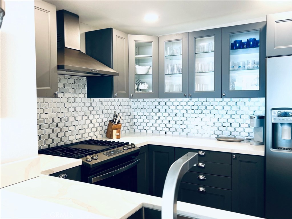 35091 Beach Road Dana Point, CA 92624 - Photo 7 of 27 a kitchen with a sink and a stove top oven