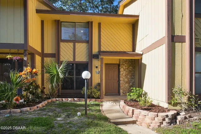 a house view with a garden space