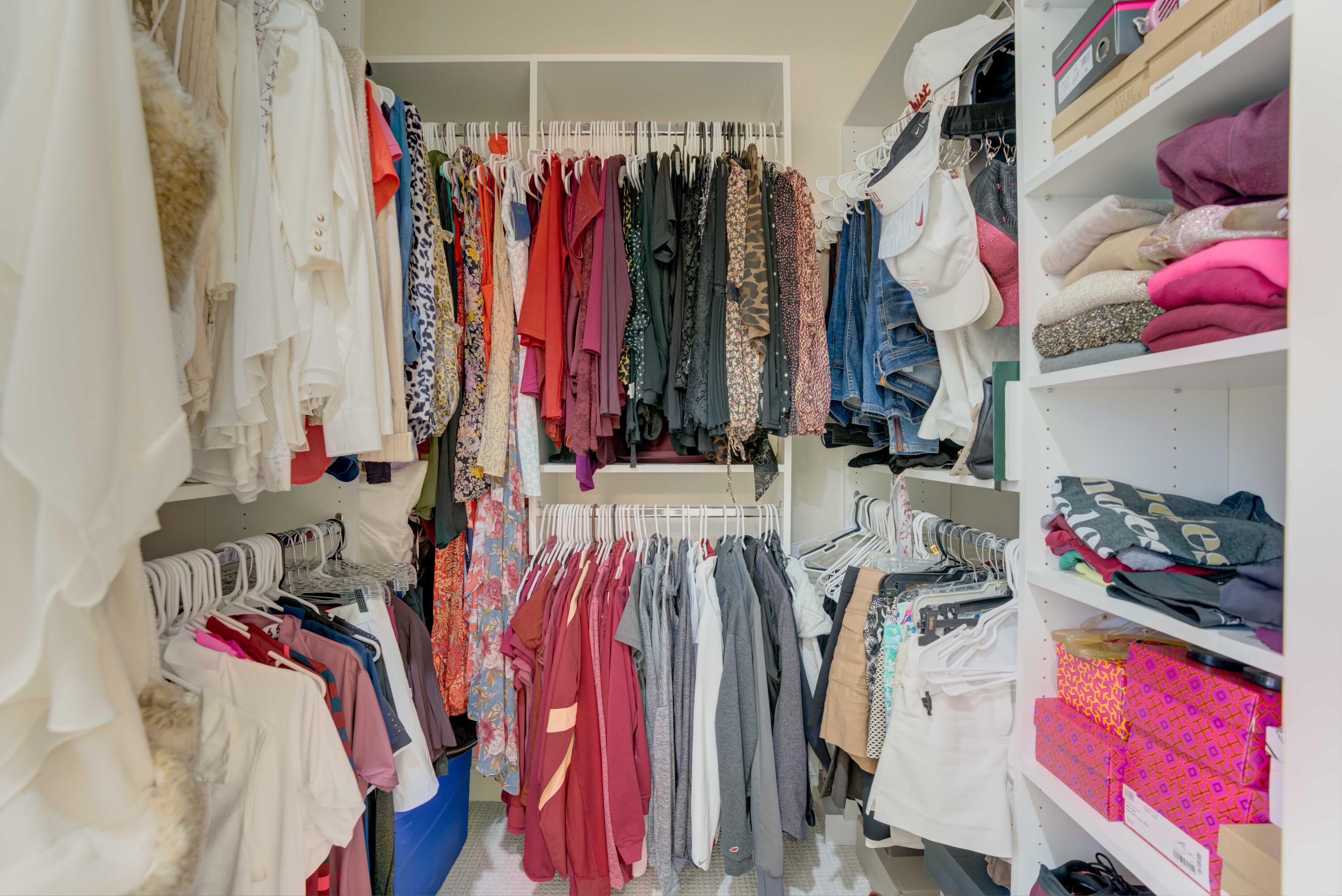 444 Red Hawk Drive Jupiter, FL 33477 - Photo 23 of 58 a view of walk in closet with clothes