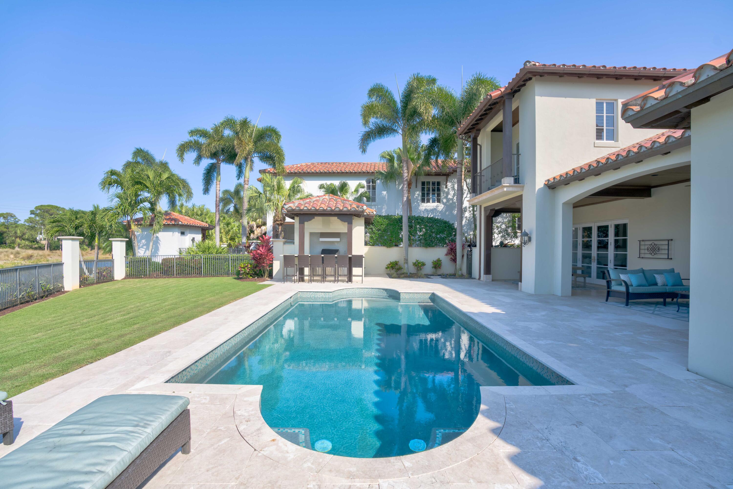 444 Red Hawk Drive Jupiter, FL 33477 - Photo 38 of 58 a view of a house with swimming pool and sitting area