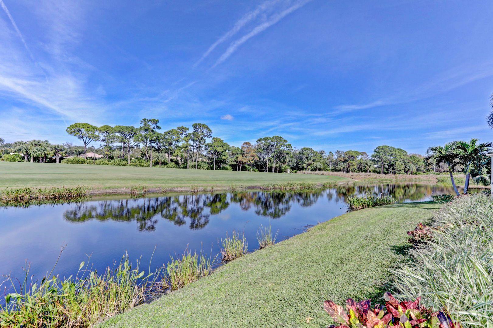 444 Red Hawk Drive Jupiter, FL 33477 - Photo 51 of 58 a view of a lake with a city