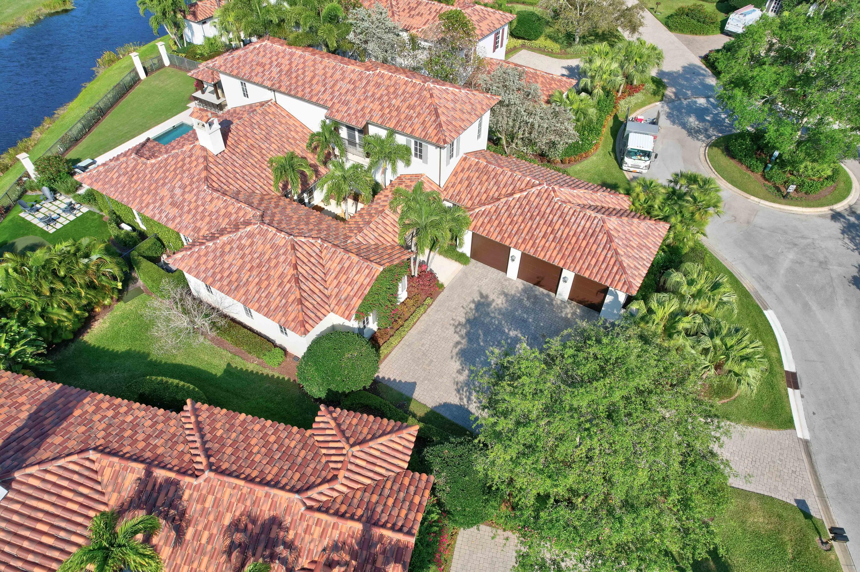 444 Red Hawk Drive Jupiter, FL 33477 - Photo 54 of 58 an aerial view of a house with a garden