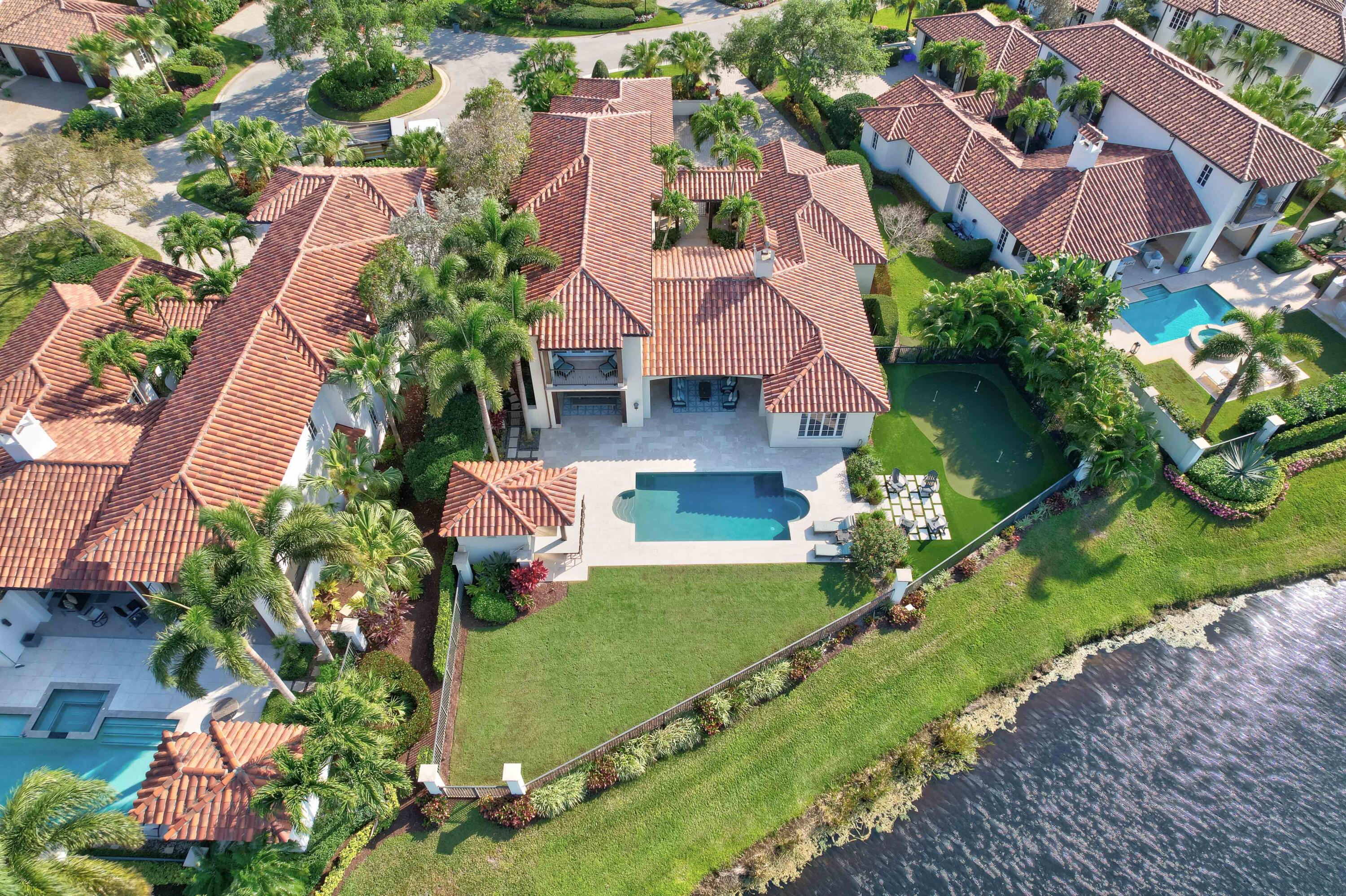 444 Red Hawk Drive Jupiter, FL 33477 - Photo 56 of 58 an aerial view of residential houses with outdoor space and street view