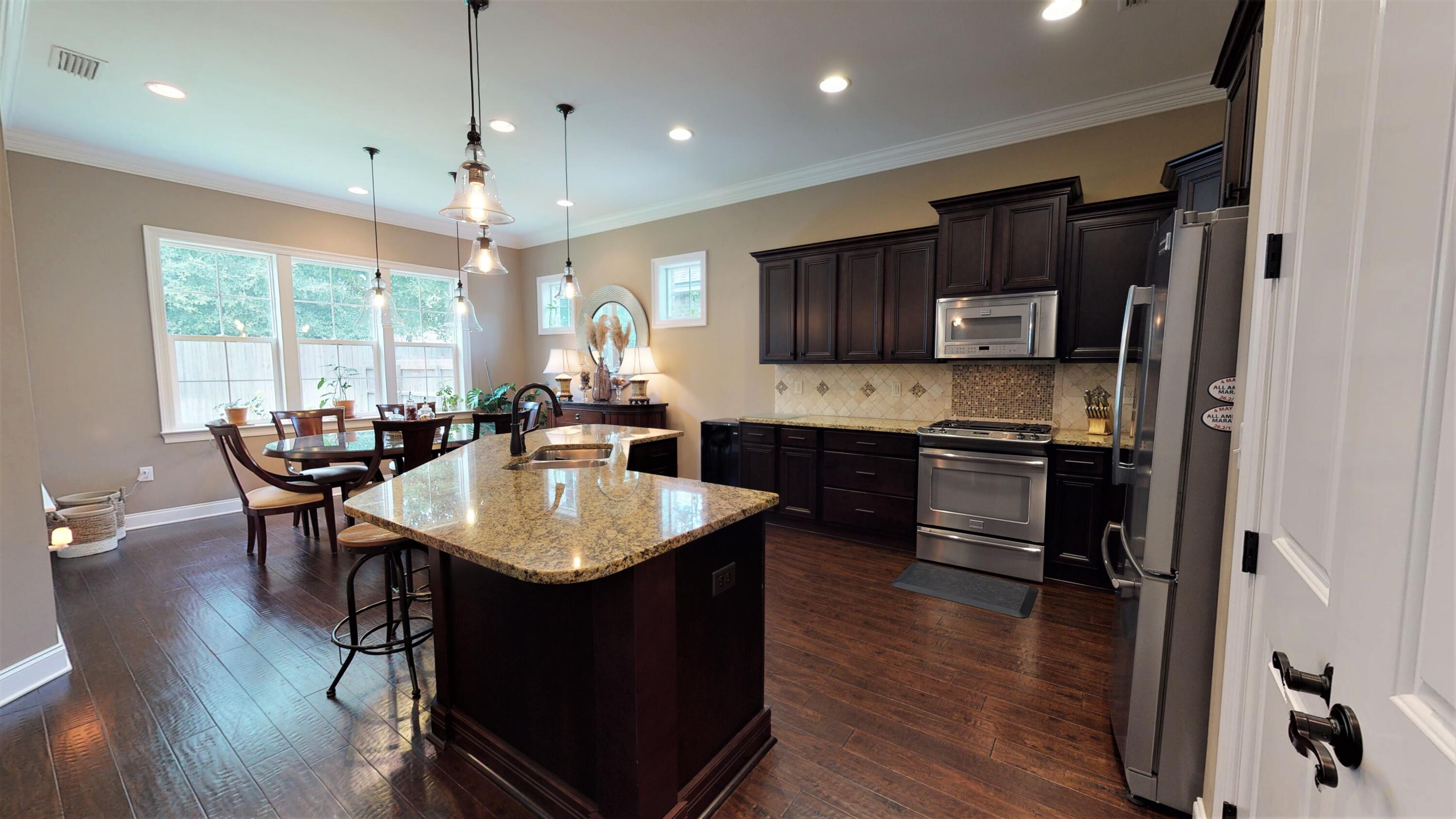 35 Derby Downs Circle Niceville, FL 32578 - Photo 11 of 51 a kitchen with kitchen island granite countertop a sink counter and chairs