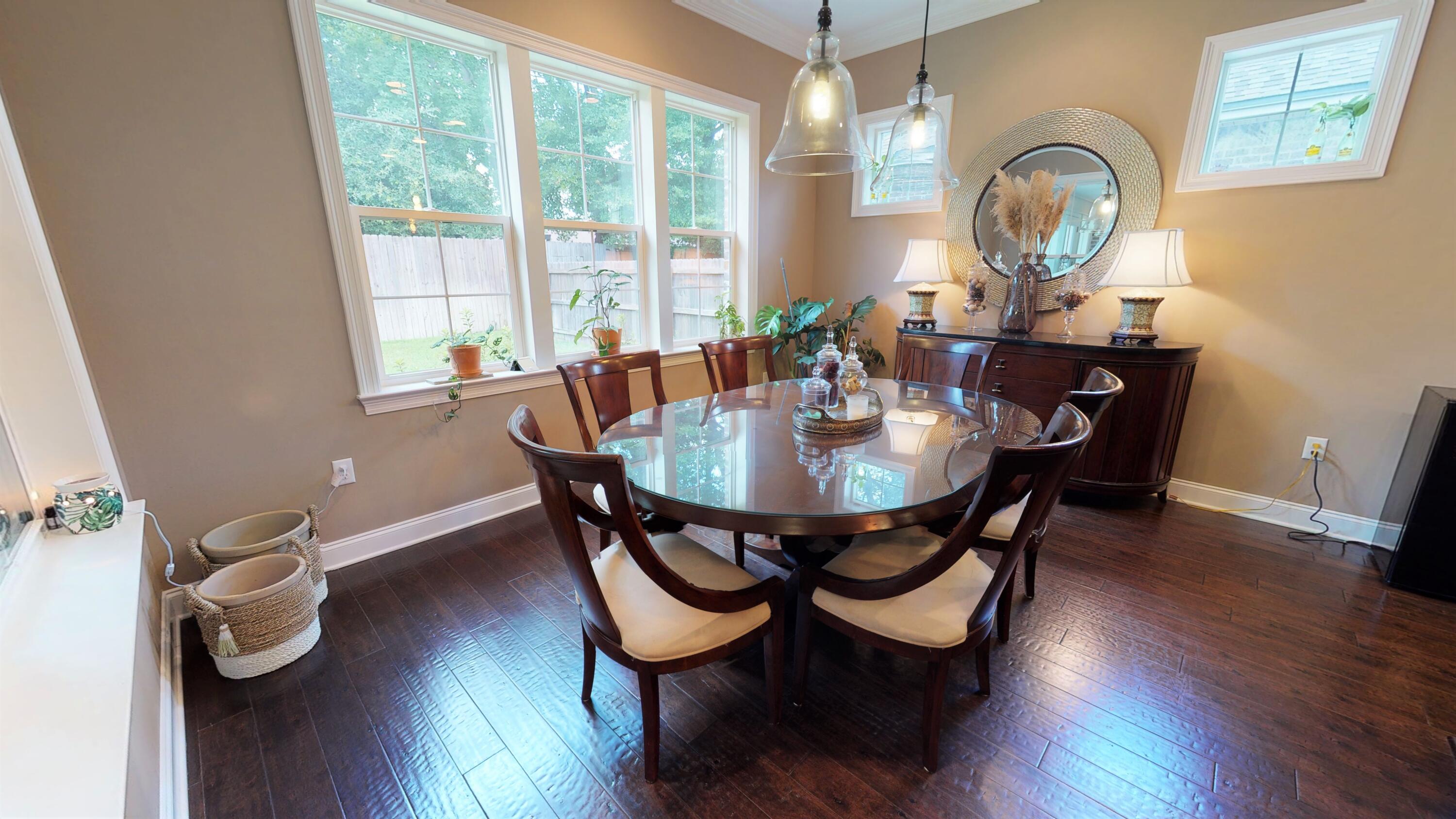 35 Derby Downs Circle Niceville, FL 32578 - Photo 13 of 51 a dining room with furniture a chandelier and wooden floor