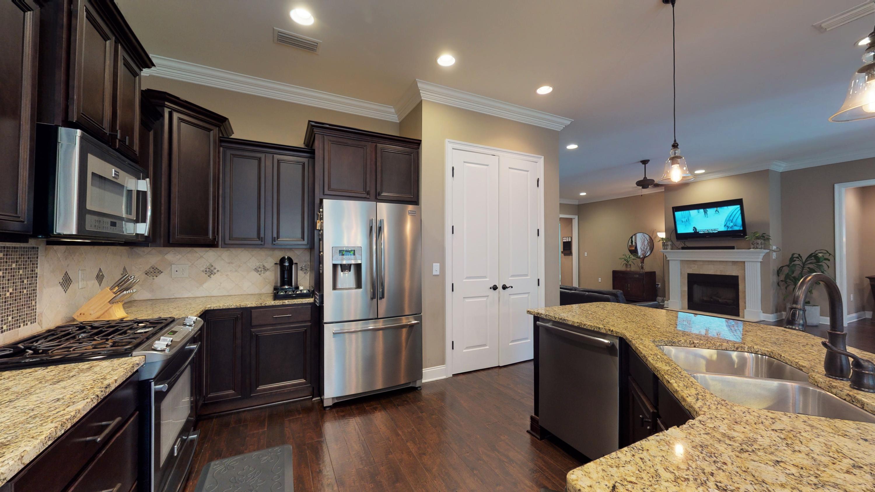35 Derby Downs Circle Niceville, FL 32578 - Photo 15 of 51 a kitchen with granite countertop a refrigerator stove and sink