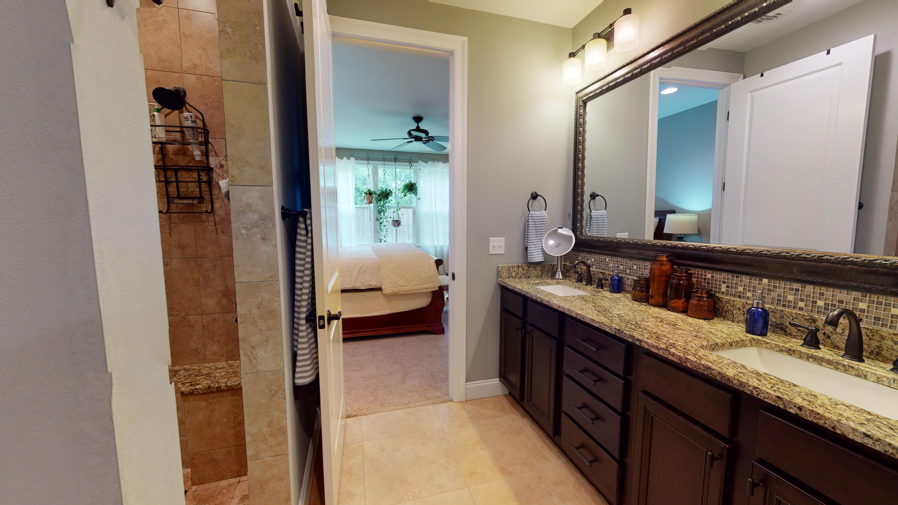 35 Derby Downs Circle Niceville, FL 32578 - Photo 24 of 51 a en suite bathroom with a granite countertop sink and a mirror