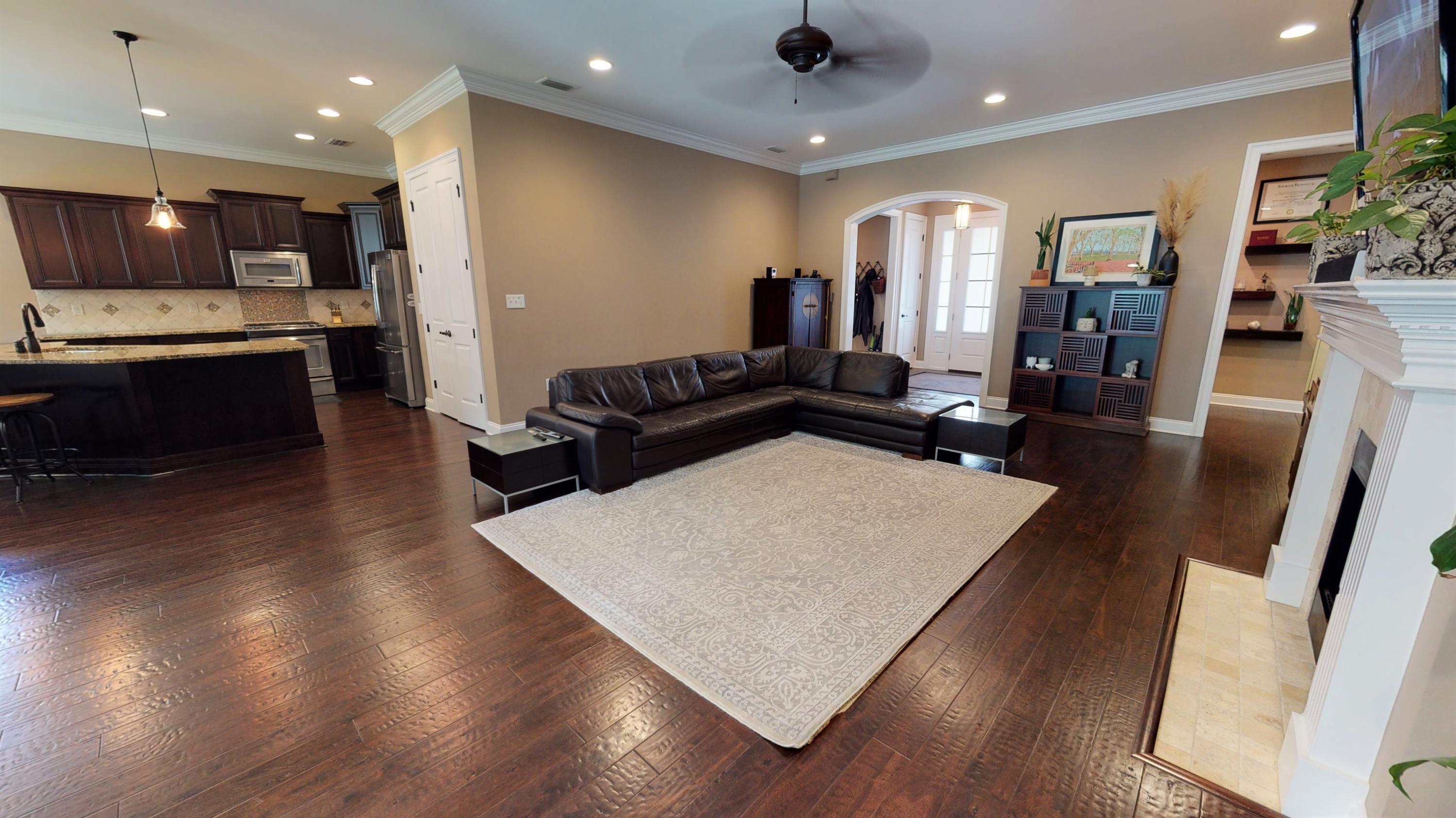 35 Derby Downs Circle Niceville, FL 32578 - Photo 9 of 51 a living room with stainless steel appliances furniture large window and wooden floor