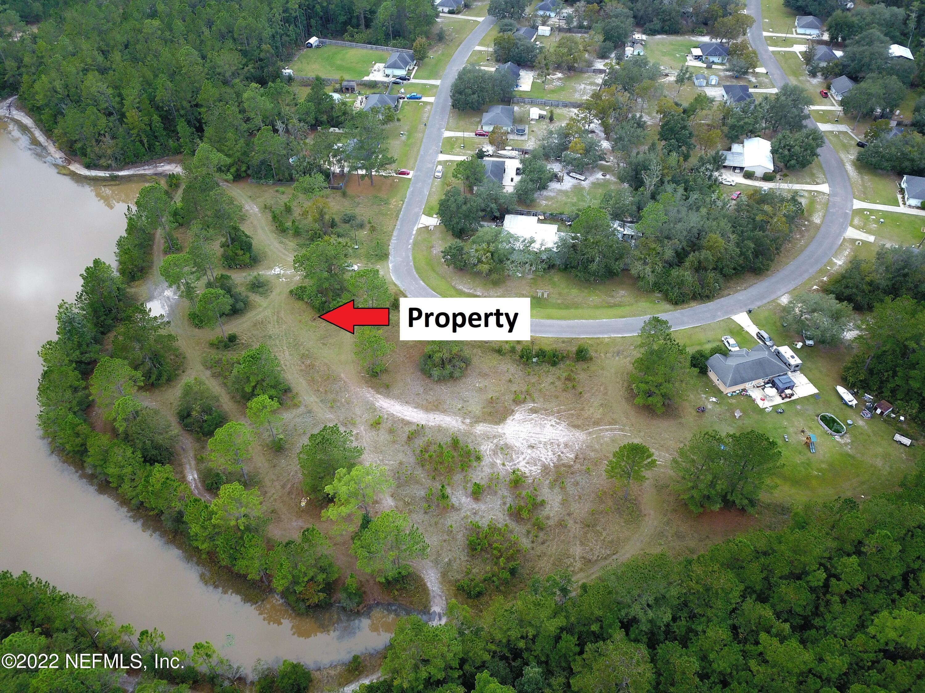 131 Blackjack Circle Palatka, FL 32177 - Photo 5 of 12 a view of flowers and sign board