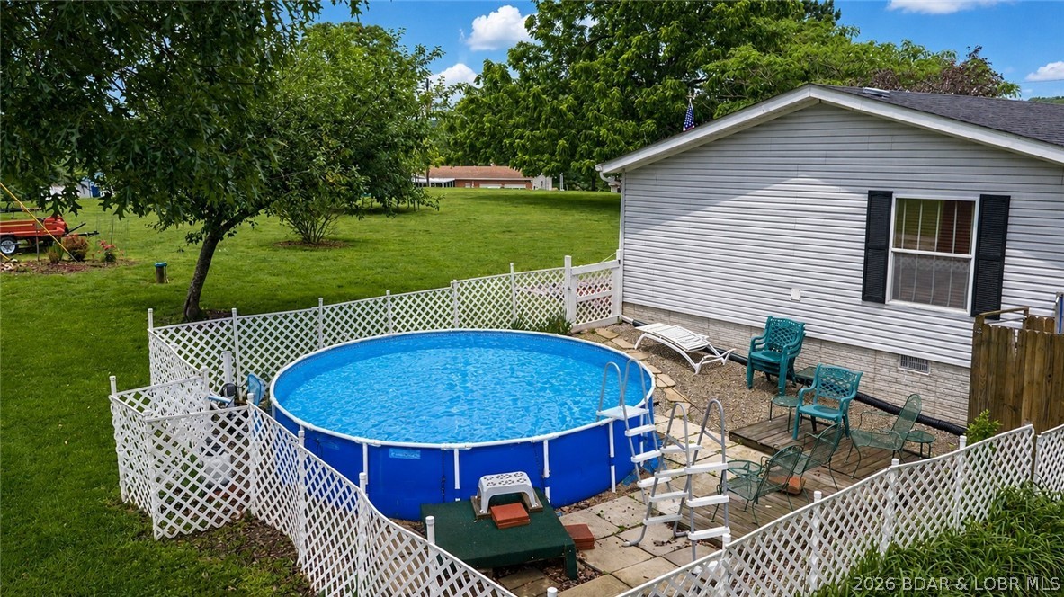 1241 Cedar Ridge Circle Roach, MO 65787 - Photo 20 of 36 Pool was AI rendered to be open; currently has cov