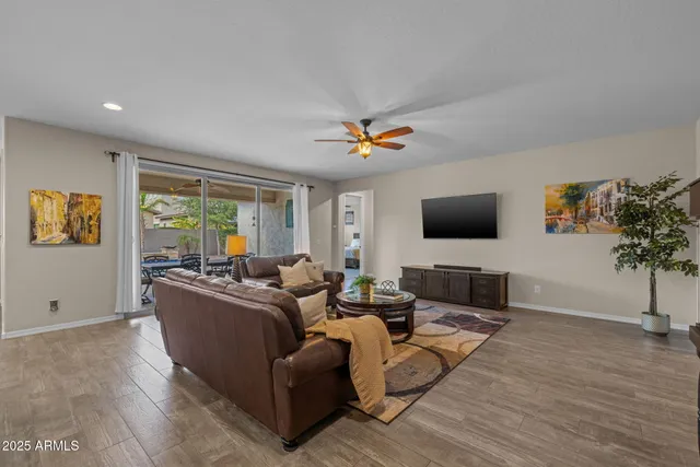 a kitchen with stainless steel appliances granite countertop a sink stove and wooden floor