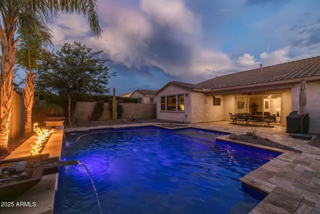 a view of a patio with a table and chairs