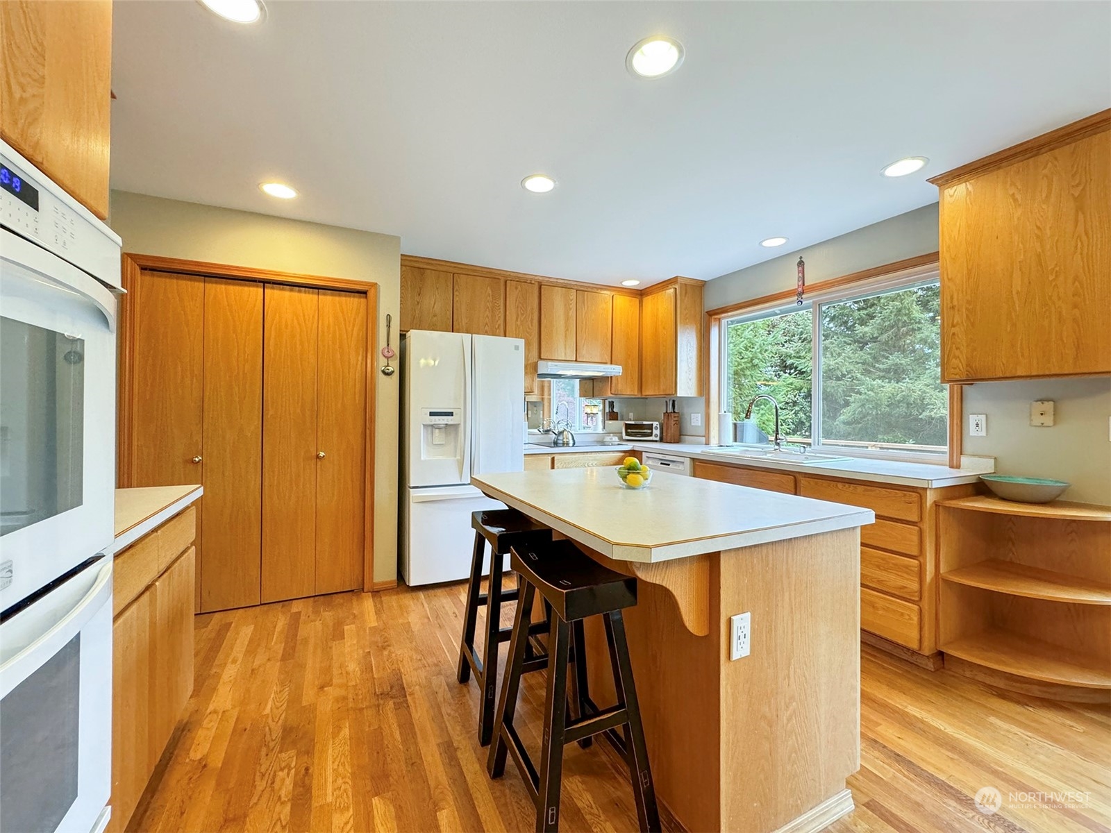 110 Henkes Road Sequim, WA 98382 - Photo 11 of 40 a kitchen with stainless steel appliances granite countertop sink stove top oven and cabinets