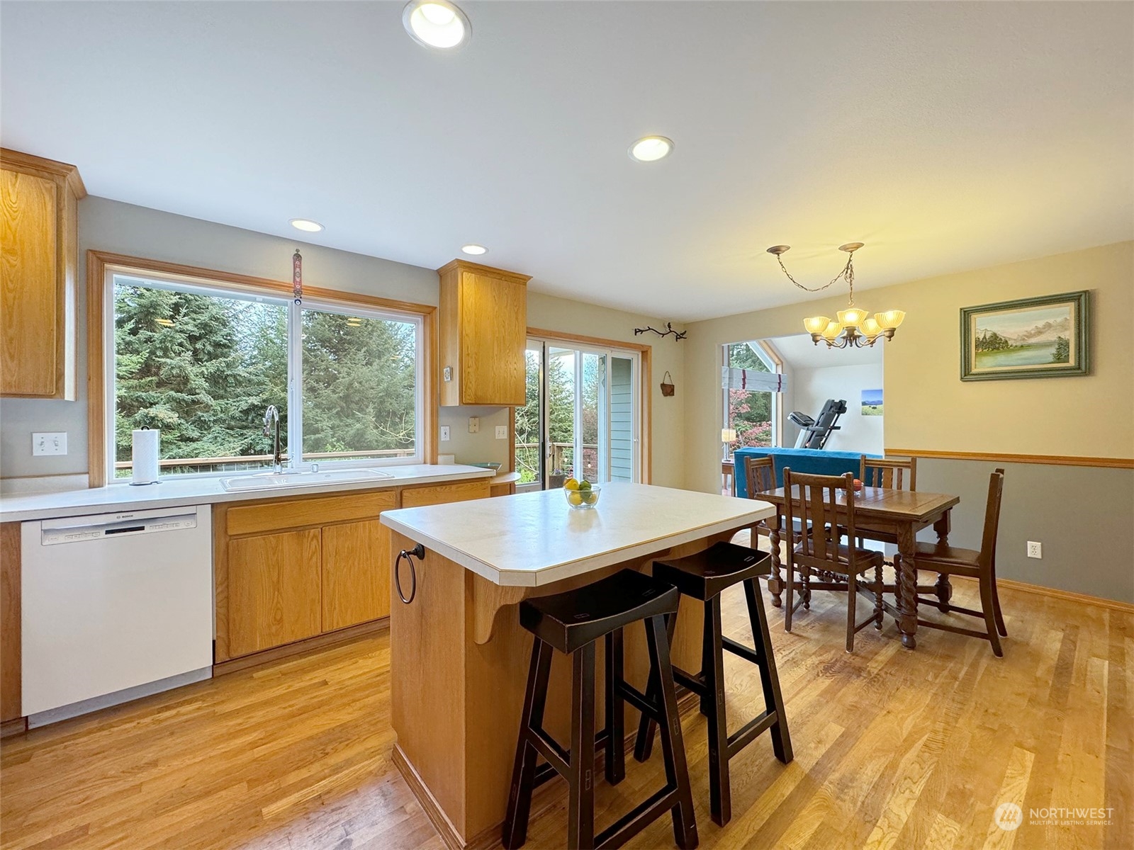 110 Henkes Road Sequim, WA 98382 - Photo 12 of 40 a view of a dining room with furniture window and wooden floor